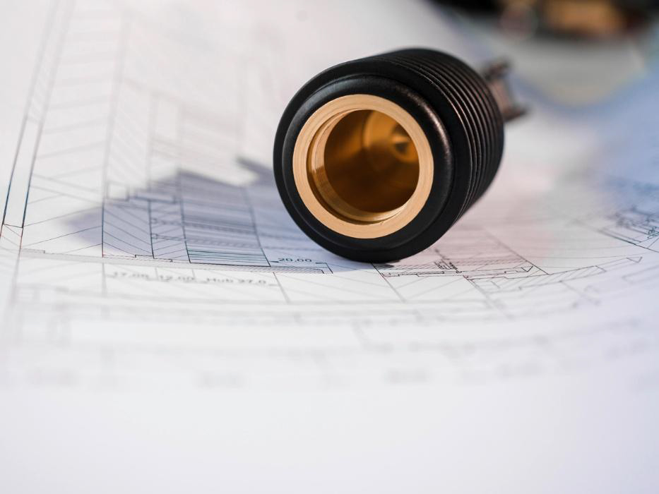 luettgens_hero_loesungen Technisches Kunststoffbauteil von Lüttgens mit CAD-Darstellung